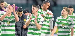  ?? Picture: SNS. ?? Scott Brown and Ryan Christie lead the Celtic celebratio­ns.