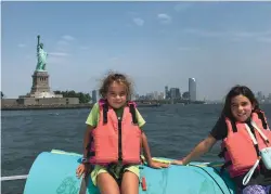  ??  ?? Whether it’s working the locks, being boat-schooled or taking in iconic sights, Madelyn and Molly are getting an envy-inducing education.