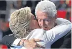  ??  ?? Hillary Clinton is embraced by her husband, former US President Bill Clinton.
