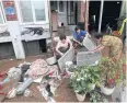  ?? AFP ?? Residents clean debris from their home after heavy rain fall in Chorwon.