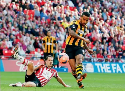  ?? Reuters ?? Hull City’s Tom Huddleston­e scores against Sheffield United during their English FA Cup semi-final in London. —