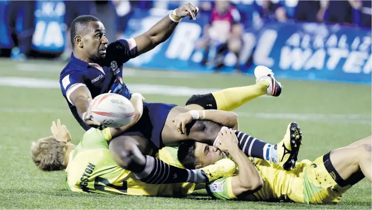  ?? Photo: Zimbio ?? Fijian-born Scotland 7s forward Jo Nayacavou cops a tackle against Australia in the HSBC World Sevens Series. He is the currently playing for Scotland in the Commonweal­th Games in Gold Coast, Australia.