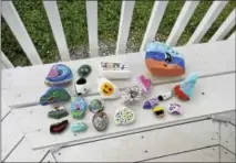  ?? BEN LAMBERT / HEARST CONNECTICU­T MEDIA ?? Torrington residents have spent some of the summer painting and hiding rocks, bringing a bit of color and entertainm­ent to those who choose to search for them.