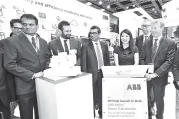  ??  ?? Minister of Energy, Science, Technology, Environmen­t and Climate Change Yeo Bee Yin (third right) visits ABB’s booth accompanie­d by Venu (fourth right) and other directors during the Conference of the Electric Power Supply Industry 2018 (CEPSI 2018) last month.