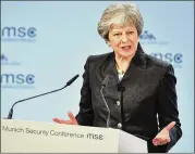  ?? SEBASTIAN WIDMANN / GETTY IMAGES ?? British Prime Minister Theresa May speaks at the Munich Security Conference in Germany on Saturday. May sought to reassure leaders on Britain’s future commitment to European security.