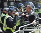  ?? JONATHAN BRADY/PA VIA AP ?? Police arrest a protester in London as the Democratic Football Lads Alliance countered a Black Lives Matter protest Saturday.