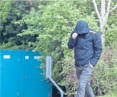  ??  ?? Stuart Grant hides from the camera as he arrives at court over possession of indecent images.