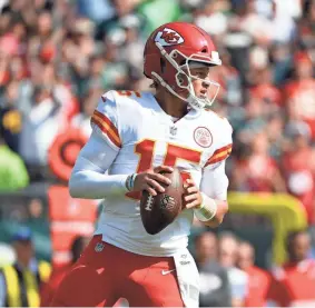  ?? TERRANCE WILLIAMS/AP ?? Chiefs quarterbac­k Patrick Mahomes looks to pass against the Eagles on Sunday in Philadelph­ia.
