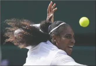  ?? The Associated Press ?? POWERING TO FINALS: Serena Williams returns the ball to Julia Gorges during their women’s singles semifinals match Thursday at the Championsh­ips, Wimbledon in London.