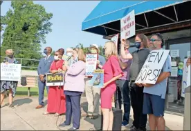  ?? John bailey, File ?? In this Sept. 10 file photo, several people gather in front of the Georgia Department of Labor’s Rome office to demand the offices be reopened. Rome City Commission­er Wendy Davis alongside two candidates for state labor commission­er, Nicole Horn and State Rep. William Boddie, spoke at the protest.