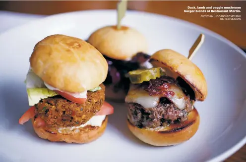  ?? PHOTOS BY LUIS SÁNCHEZ SATURNO THE NEW MEXICAN ?? Duck, lamb and veggie mushroom burger blends at Restaurant Martín.