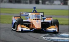  ?? DARRON CUMMINGS — THE ASSOCIATED PRESS ?? Race driver Scott Dixon won at the Indianapol­is Motor Speedway for the second time in his career on Saturday.