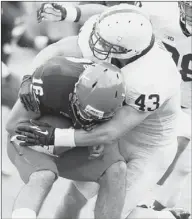  ??  ?? Linebacker Mike Hull sacks Virginia quarterbac­k Michael Rocco in the second half.