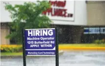  ?? AP FILE PHOTO/NAM Y. HUH ?? A hiring sign is displayed in Downers Grove, Ill. The number of Americans filing for unemployme­nt benefits rose slightly last week. The government said Thursday jobless claims increased by 2,000 from the previous week to 373,000.