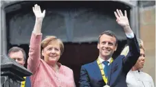  ?? FOTO: DPA ?? Angela Merkel und Emmanuel Macron in Aachen.