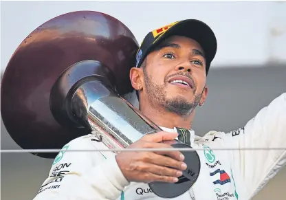  ?? Getty. Picture: ?? Lewis Hamilton, seen celebratin­g on the podium after winning the Japanese Grand Prix, knows he can secure the Formula One title with victory in Austin, Texas.