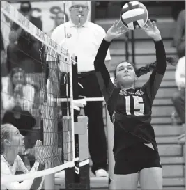  ?? Staff photo/John Zwez ?? New Bremen’s Melina Schrader sets the ball to a teammate Thursday night in the Cardinals match with New Knoxville.