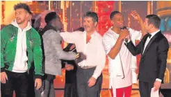  ??  ?? Simon Cowell and Dermot O’Leary congratula­te Rak-Su on their victory