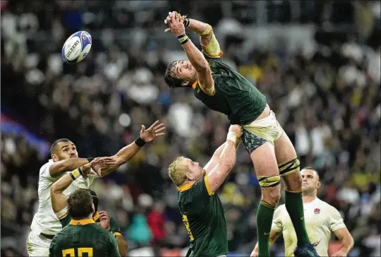  ?? CHRISTOPHE ENA/AP ?? South Africa’s Franco Mostert fails to collect the ball during the Rugby World Cup semifinal match between England and South Africa at the Stade de France in Saint-denis Oct. 21. South Africa barely won that one, 16-15. South Africa faces New Zealand today at the Rugby World Cup Final, a matchup that hasn’t happened since 1995.