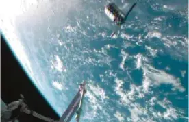  ??  ?? NEW YORK: This framegrabb­ed image provided by NASA-TV shows the Cygnus spacecraft at the 30 meter hold point from the Internatio­nal Space Station yesterday as both cross over the Atlantic Ocean. — AP