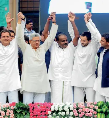  ?? PTI ?? ALL FOR ONE... Rahul Gandhi with Opposition leaders at Karnataka CMH.D. Kumaraswam­y’s swearing in