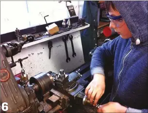  ??  ?? PHOTO 6: Machining the flywheel for the oscillatin­g engine on a Myford MLR7 lathe.
All photos and diagrams in this feature by Peter and Matthew Kenington
6