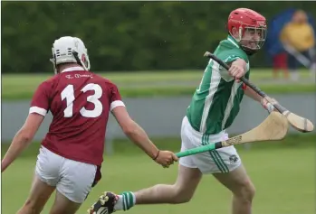  ??  ?? Jamie Doran of Dunbrody Gaels tries to shake off the presence of Rory O’Connor (St. Martin’s).