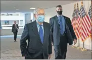  ?? ASSOCIATED PRESS] ?? Senate Majority Leader Mitch McConnell, R-Ky., arrives for a closed-door meeting with Senate Republican­s, Friday on Capitol Hill in Washington. [J. SCOTT APPLEWHITE/ THE