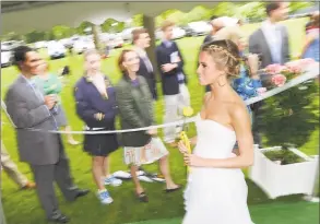  ?? Hearst Connecticu­t Media file photo ?? She may be dressed in white, but this isn’t her wedding. Then-18-year-old Cassidy Gifford, of Greenwich, during her Greenwich Academy graduation at the main campus in 2012.