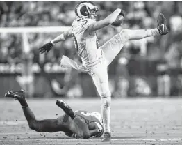  ?? Jeff Lewis / Associated Press ?? As usual, Cooper Kupp stepped up for the Rams as the NFL’s leading receiver had 13 catches for 123 yards and a touchdown.