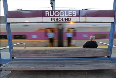  ?? STUART CAHILL / HERALD STAFF FILE ?? WITH A BULLET: A commuter rail train leaves Ruggles Station in Roxbury