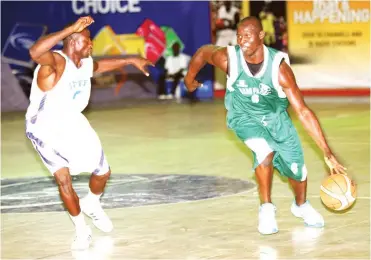  ??  ?? Kano Pillars (green) in action against Royal Hoopers during a league game