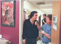  ?? SHERRIE BUZBY/THE REPUBLIC ?? Danny Zelisko, right jokes around backstage with Paul Stanley before a 2000 KISS concert at Desert Sky Pavilion.