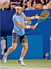  ?? —
AFP ?? Frances Tiafoe of USA returns a shot to Andy Murray of Great Britain on Day 4 of the Winston-Salem Open at Wake Forest Tennis Complex in Winston Salem, North Carolina, on Tuesday .