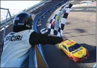  ?? CHRIS GRAYTHEN/GETTY IMAGES/TNS ?? Joey Logano, driver of the #22 Shell Pennzoil Ford, crosses the finish line to win the NASCAR Cup Series FanShield 500 at Phoenix Raceway on March 8 in Avondale, Ariz.