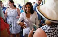  ?? AP PHOTO BY CHARLIE NEIBERGALL ?? Democratic presidenti­al candidate Sen. Kamala Harris greets local residents during the West Des Moines Democrats’ annual picnic, Wednesday, July 3, 2019, in West Des Moines, Iowa.