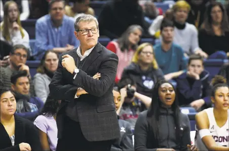  ?? Stephen Dunn / Associated Press ?? Coach Geno Auriemma and the UConn women’s basketball team will begin on-the-court activities on Tuesday.