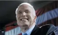  ?? CHARLES DHARAPAK — THE ASSOCIATED PRESS ?? In this file photo, Republican presidenti­al hopeful Sen. John McCain, R-Ariz., celebrates in Miami after winning the Florida Republican presidenti­al primary.