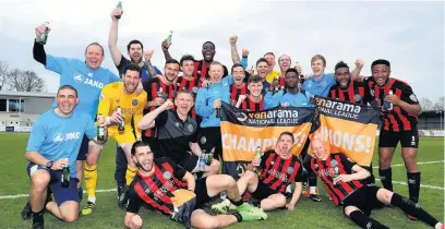  ??  ?? The beer was flowing as Macclesfie­ld Town won promotion back to the Football League in April. Manager John Askey left the club just weeks later