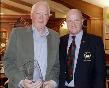  ??  ?? Jerry O’Riordan, men’s singles matchplay winner at Courtown, with the Captain, John Fitzgerald.