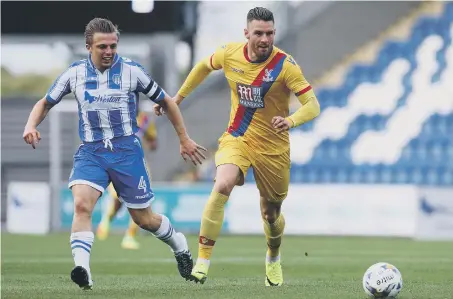  ??  ?? Former Sunderland striker Connor Wickham (right) gets away from Tom Lapslie in Crystal Palace’s 1-0 friendly win at Colchester last night