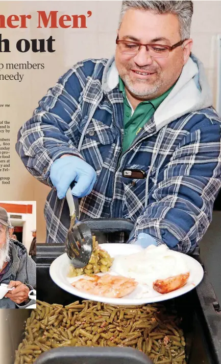  ?? [PHOTOS BY THOMAS MAUPIN, FOR THE OKLAHOMAN] ?? Cris Garza, Rother Men’s group member, adds hot green beans to a plate for a hungry person at Wiley Post Park.