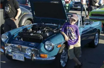  ??  ?? Caleb Johnston was into the old-car hobby at age 3. Now 7, Caleb and his dad take the restored MGB to shows.