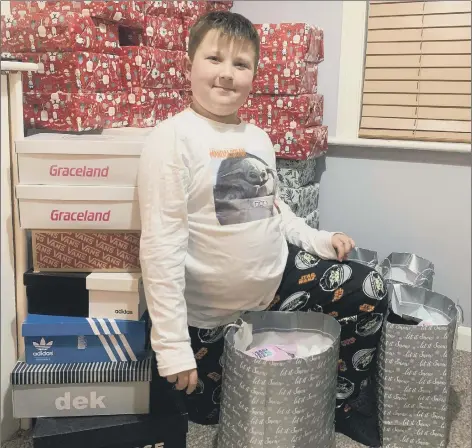  ??  ?? GENEROUS Albie Leahy, 8 from Waterloovi­lle, has created shoeboxes for the homeless people of Portsmouth to enjoy this Christmas