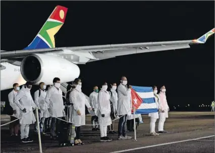  ?? Photo: Jacoline Schoonees/dirco ?? Agreement: More than 200 Cuban health workers arrived at the Waterkloof Air Force Base in Pretoria on 27 April 2020, to support efforts to curb the spread of Covid-19.