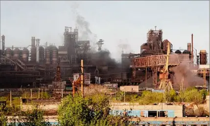  ?? Alexei Alexandrov / Associated Press ?? Smoke rises from the Metallurgi­cal Combine Azovstal in Mariupol during shelling, in Mariupol, in territory under the government of the Donetsk People’s Republic, eastern Ukraine, Saturday.