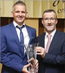  ??  ?? Paul Keogh from Bray receiving the Volunteer of the Year Award from Bryan Doyle of Wicklow County Council.