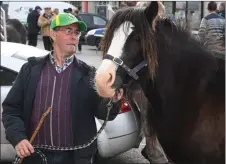  ??  ?? Killorglin man Frank Cronin with a horse named Bob on Market Street on Thursday.