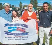  ?? COURTESY JOHN HUNTER ?? Andrew Graham-Yooll (second from right) and John Hunter (far right) at the Anglo-Argentine Society annual asado in London in 2015.