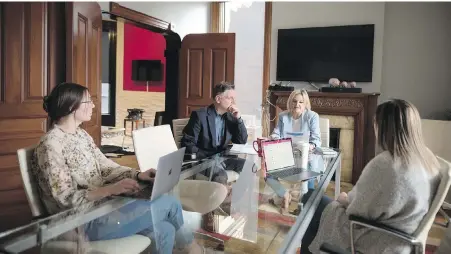  ?? THE CANADIAN PRESS ?? From left, Lynda Trudell, Terance Brouse, Julie Rusciolell­i and Megan Dunscombe work during a meeting at the PR agency Maverick, in Toronto, on Wednesday. The company allows its employees to work from home on Thursdays and Fridays.